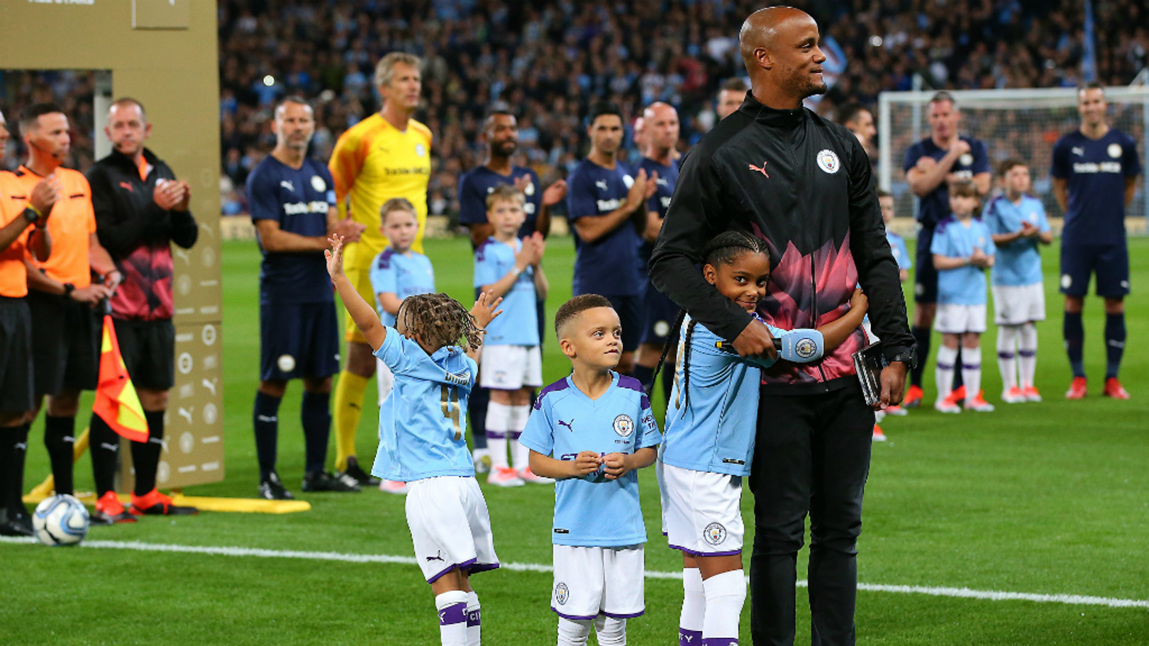 Manchester City Legend's and Premier League All Stars XI players hold up a  banner for the Tackle4MCR campaign prior to the beginning of the Vincent  Kompany Testimonial at the Etihad Stadium, Manchester