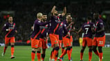 SQUAD: City celebrate after Mahrez bags his fifth goal for the club.