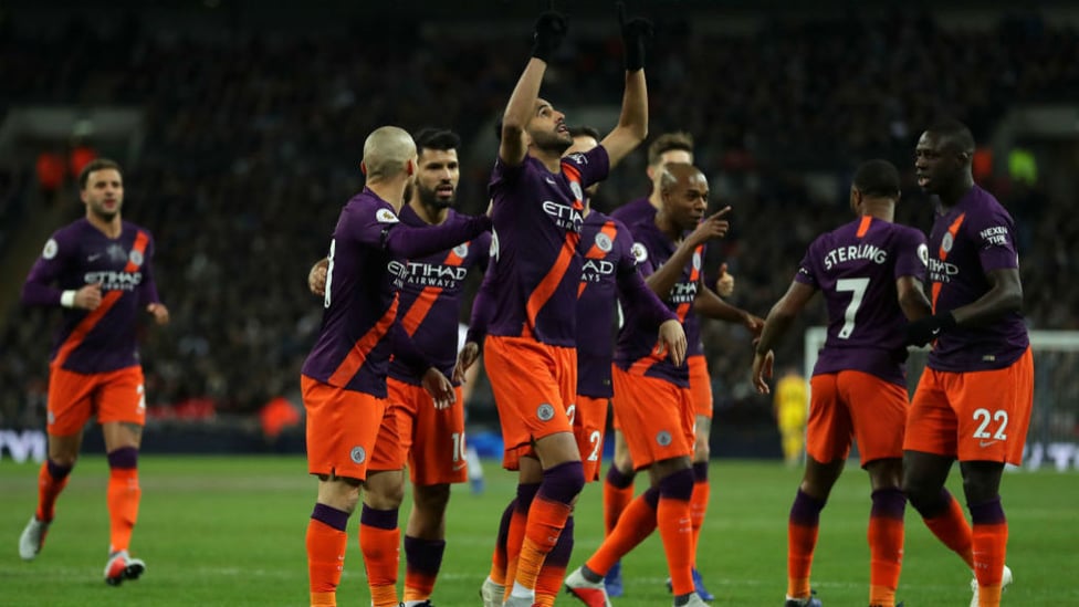 SQUAD : City celebrate after Mahrez bags his fifth goal for the club.