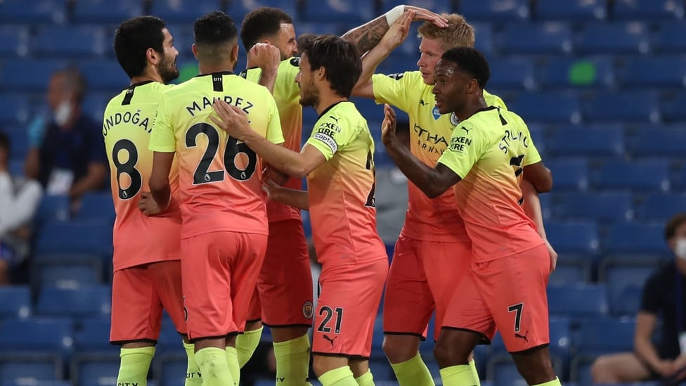 FEELING THE LOVE : The players flock to congratulate De Bruyne after his stunning free-kick.