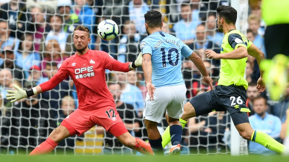 CHEEKY CHIP : Sergio Aguero opens the scoring with a glorious clipped finish over Ben Hamer