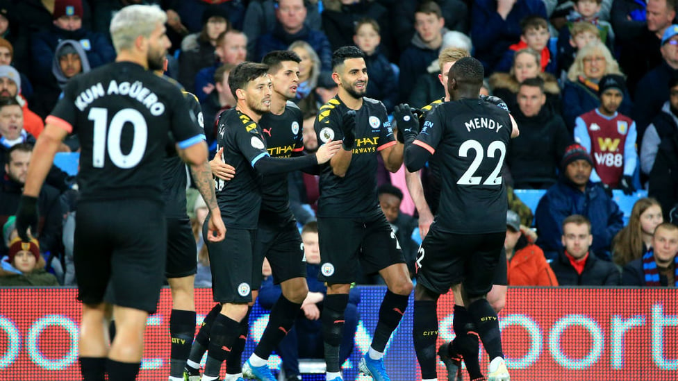 CELEBRATION TIME : The City players salute Riyad Mahrez after his opening strike