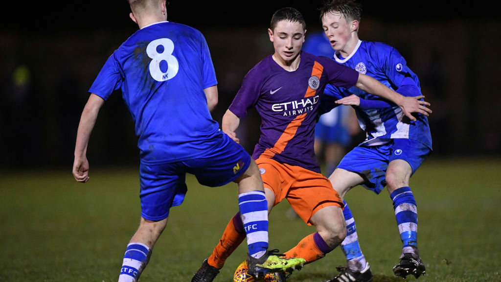 ACTION STATIONS : Joe Hodge looks to weave his way through the Clevedon Town midfield