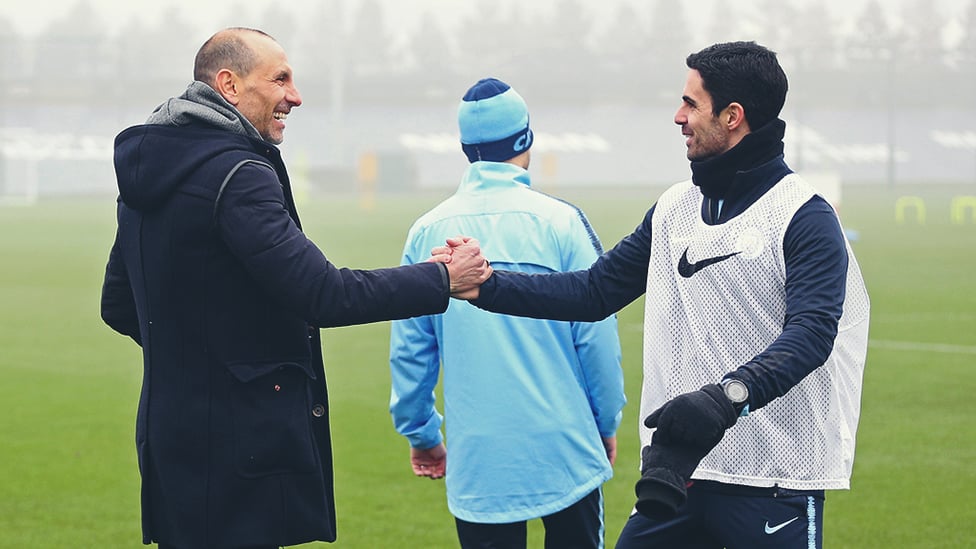 SHAKE ON IT : Martin Petrov exchanges greetings with assistant coach Mikel Arteta