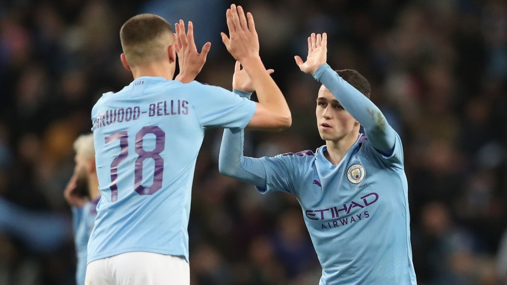 HIGH FIVE: Phil Foden and Taylor Harwood-Bellis celebrate against Port Vale.