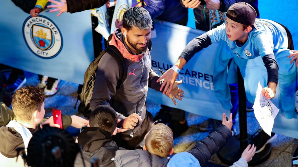 A WARM WELCOME : Sergio Aguero greets waiting fans before tonight's Group C tie