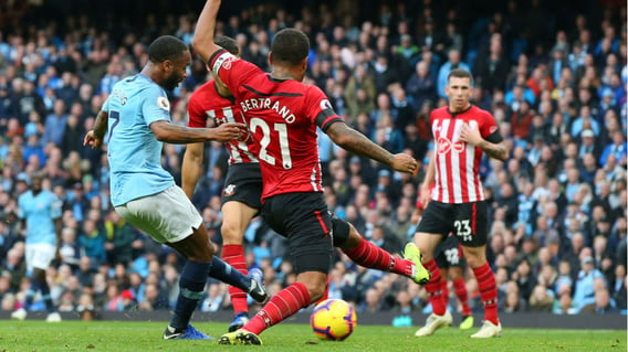 STER CRAZY: Raheem Sterling drills home City's fourth goal on the stroke of half-time