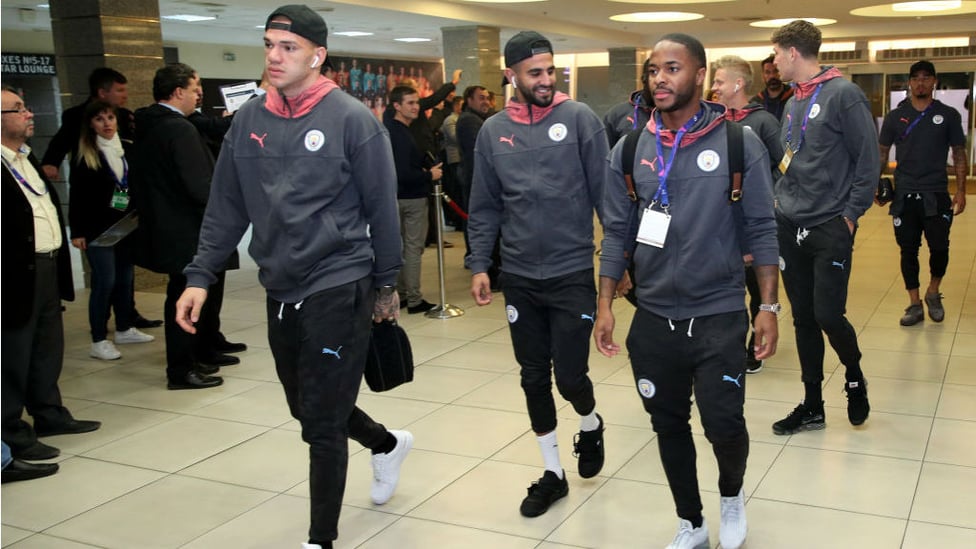 ARRIVAL TIME : The City squad make their way into the Metalist Stadium in Kharkiv