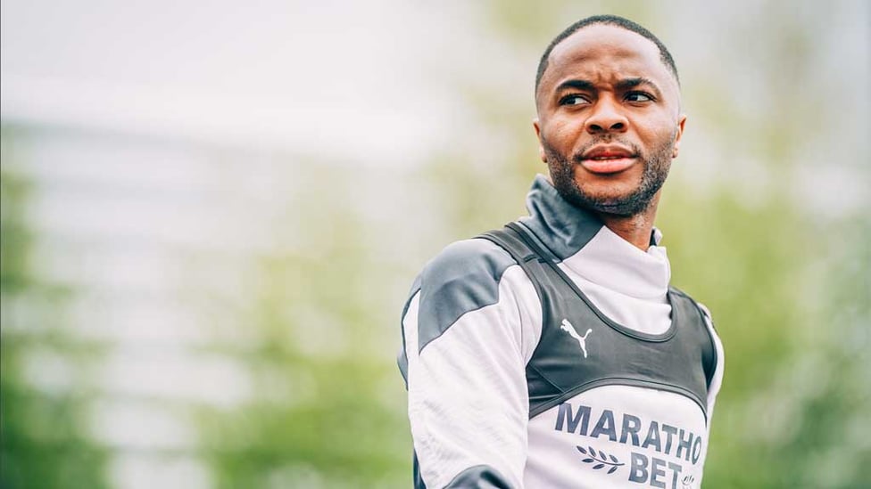 IN FOCUS : Raheem Sterling getting into the zone as he heads out onto the training pitch.