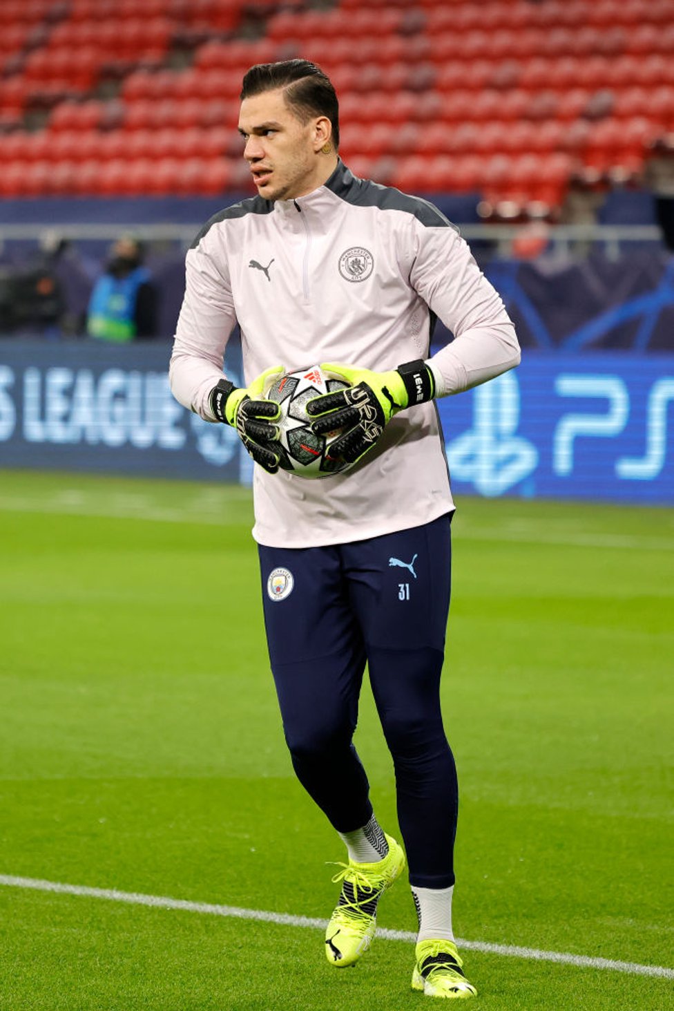 STEADY EDDIE : Our Brazilian shot-stopper gets a feel of the ball during the warm up.