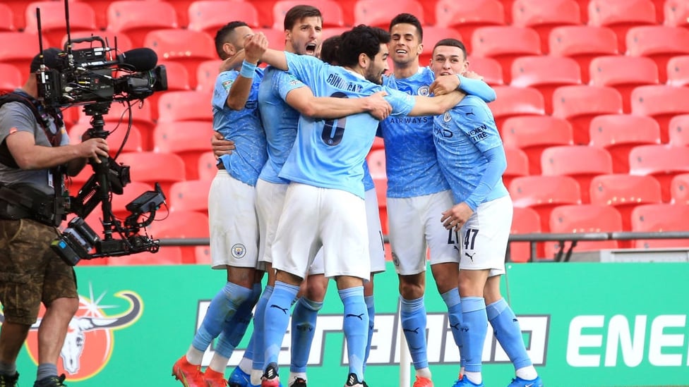 SQUAD GOALS : The players gather to celebrate Laporte's thumping header.