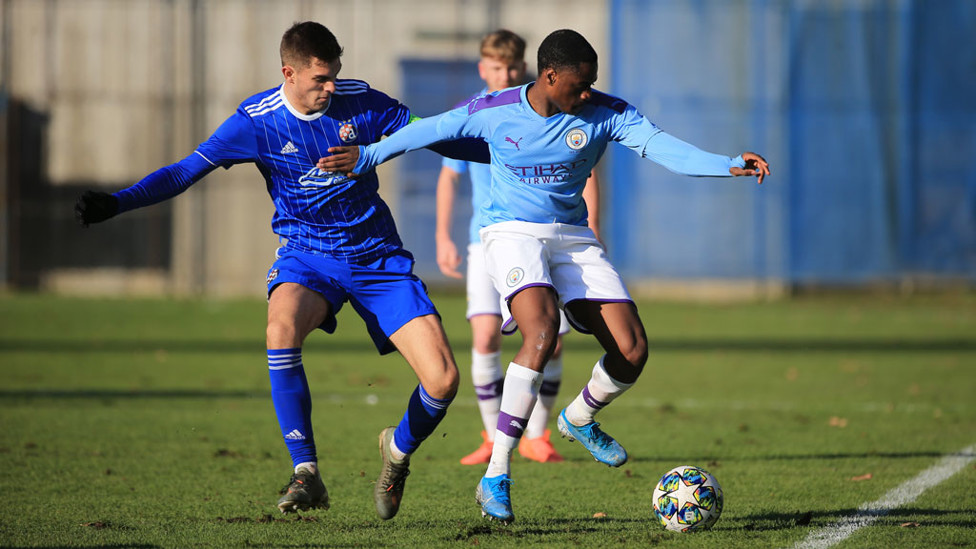 ON THE BALL : Nat Ogbeta vies for possession