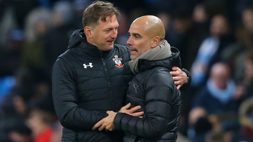 RESPECT : A warm embrace at full-time between the managers.