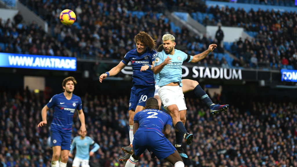 MOVE ON UP: Aguero rises for the ball and lifts City back to the top of the table.