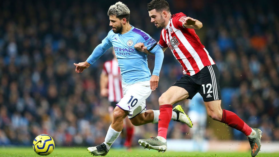 SERGE OF PACE : Sergio Aguero tussles for possession with John Egan