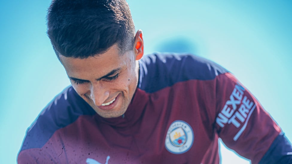 PORTU-GEEZER: Joao Cancelo shows off his pearly whites