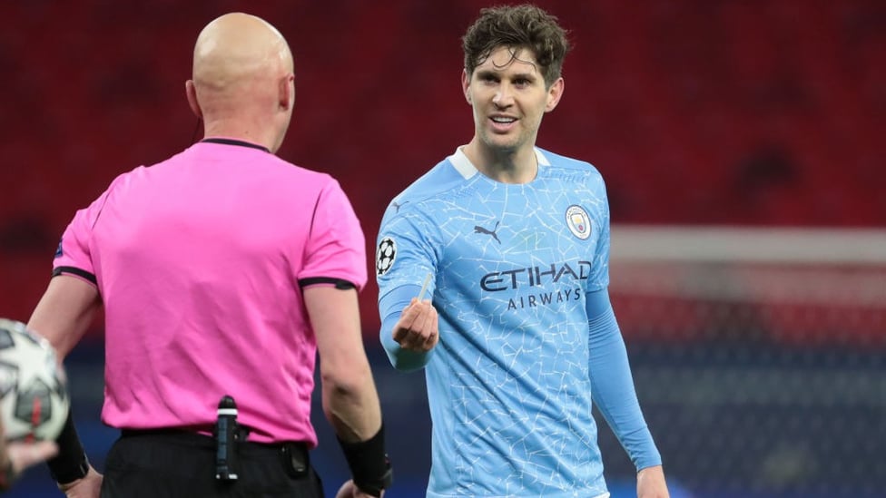 LOST AND FOUND: John Stones gives referee Sergey Karasev his pencil back!