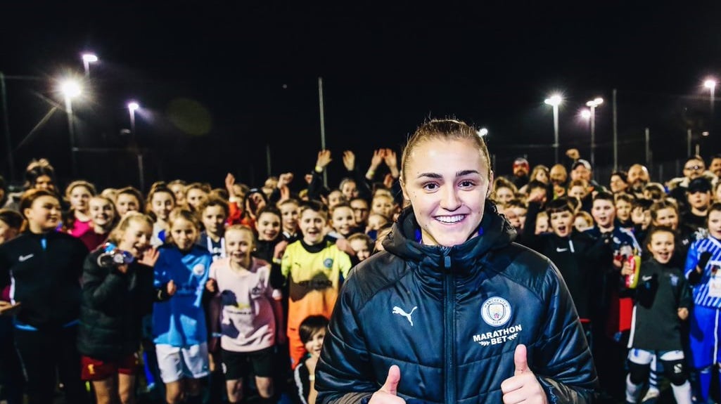 CAST OF THOUSANDS: A legion of awe-struck youngsters with Georgia in Barrow