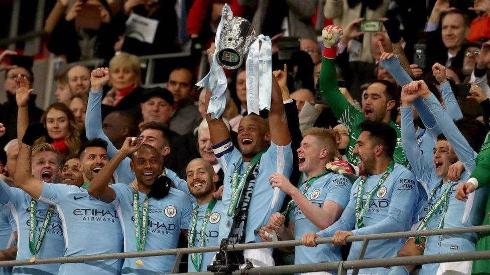 ​CHAMPIONS : Vincent Kompany lifts the Carabao Cup for the third time as City captain