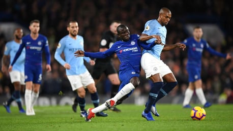 MY BALL: Fernandinho shows his strength to hold off Kante