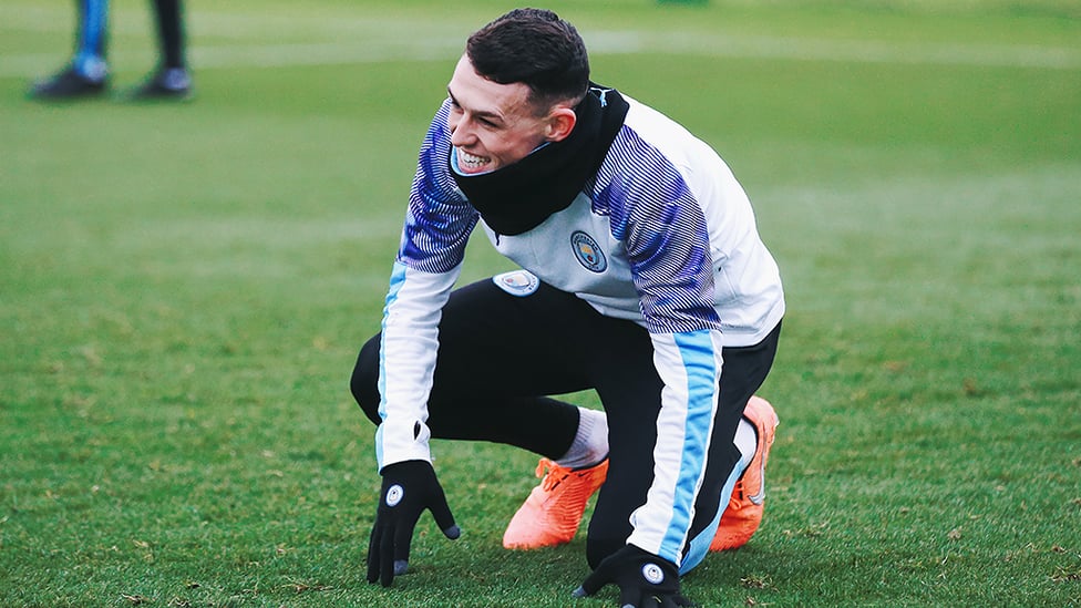 PHIL YOUR BOOTS : Something has given Phil Foden an attack of the giggles!