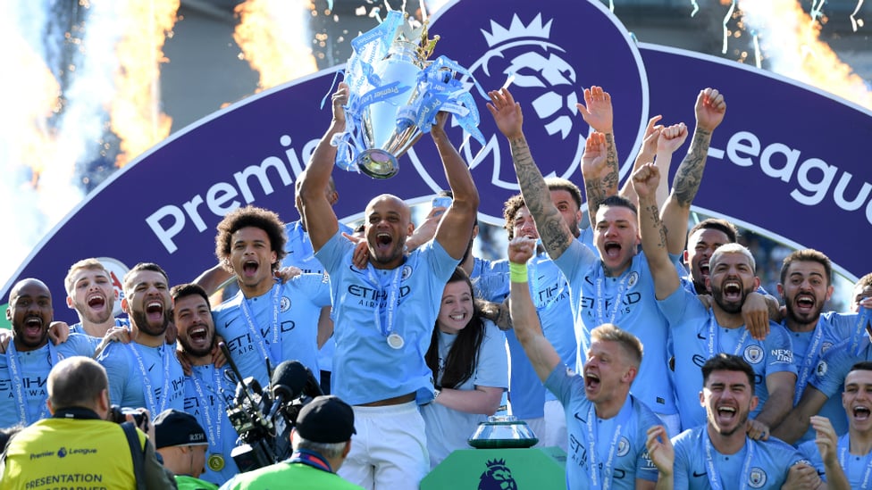 CHAMPIONS : Vincent Kompany lifts City's fourth Premier League trophy aloft