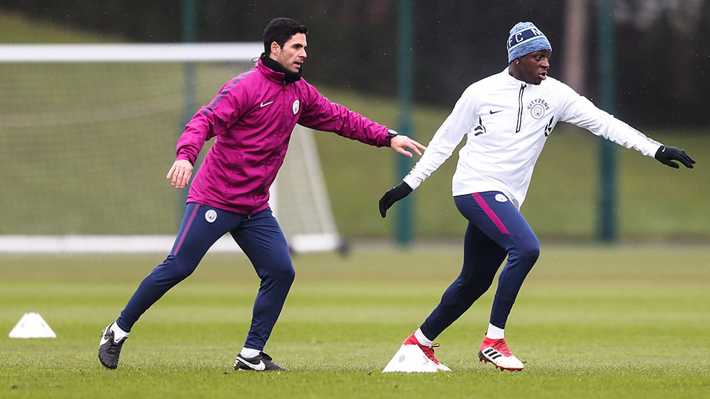 COOL MOVES: Mendy gears up with Mikel Arteta.