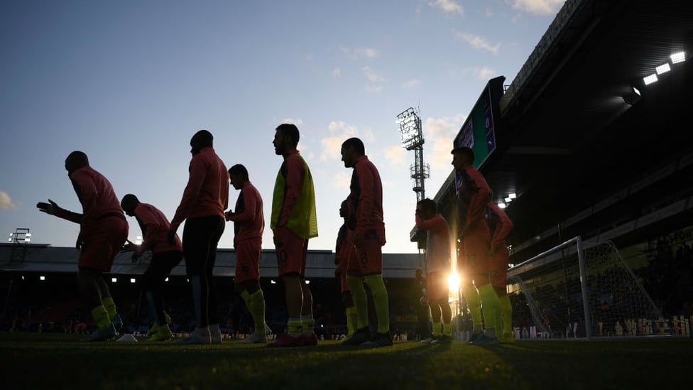 WARM UPS : The boys loosen up prior to kick off.