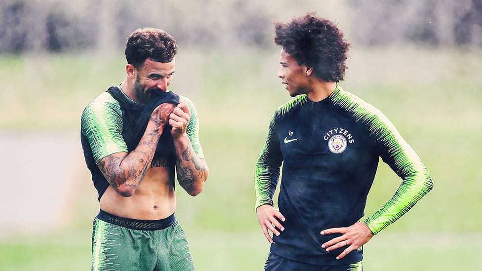 BREATHER : Kyle Walker and Leroy Sane take a break