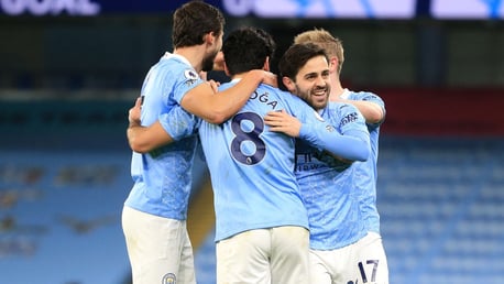 CENTRE OF ATTENTION: The players share the love with Gundogan after his wonderful goal.