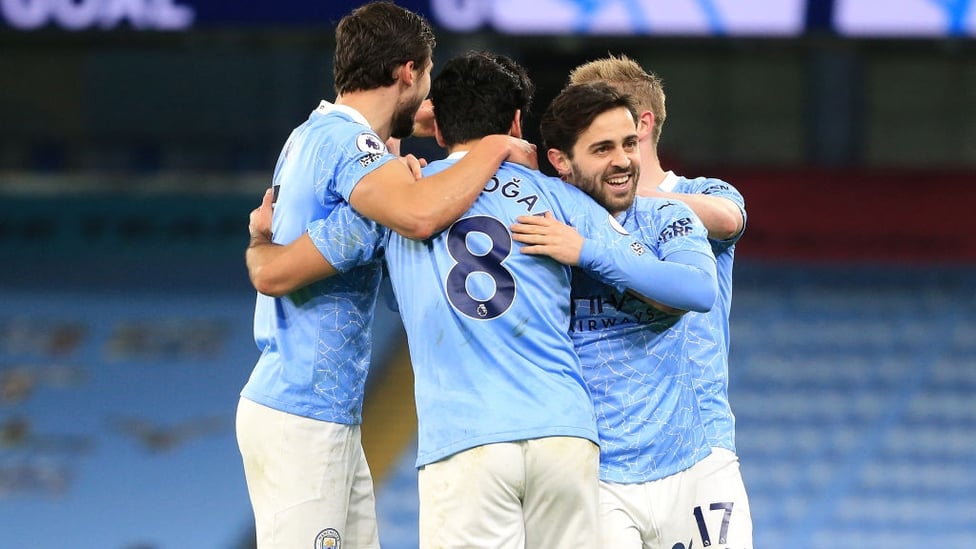 CENTRE OF ATTENTION : The players share the love with Gundogan after his wonderful goal.