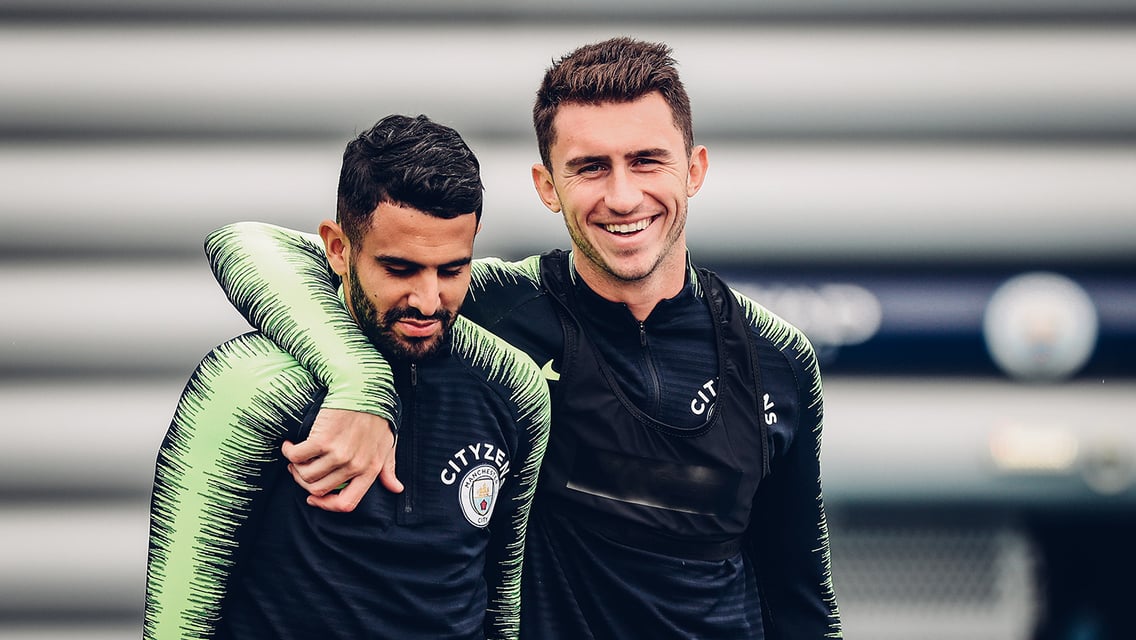 TEAM MATES: Mahrez and Laporte head out to the training pitches. 