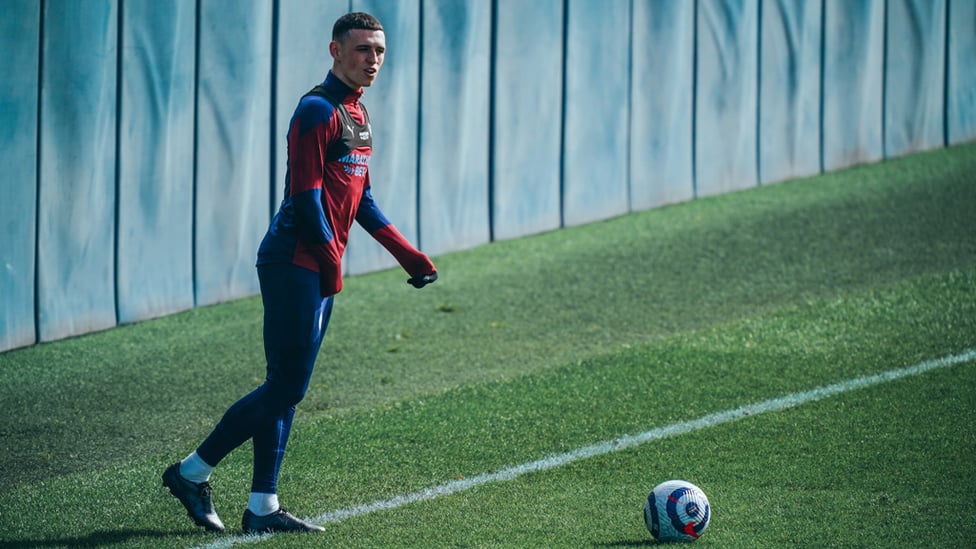FODEN FOCUS: Phil Foden looks to pick out a teammate