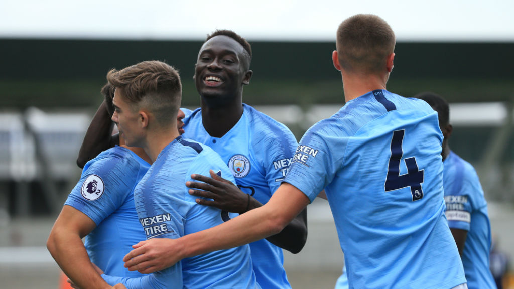 ALL SMILES : The City players celebrate after going 2-0 up against Derby