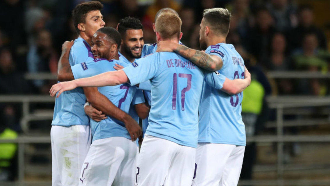 CENTRE OF ATTENTION: Riyad Mahrez is mobbed by his team-mates after his first half goal