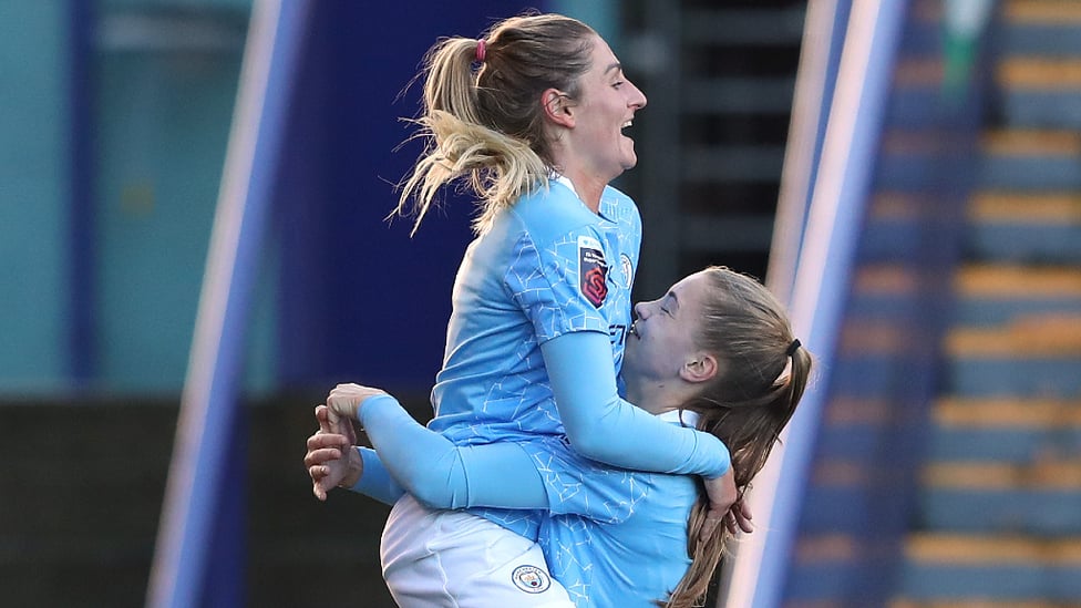 JUMPING FOR JOY : Laura Coombs celebrates her stunning goal against former club, Liverpool.