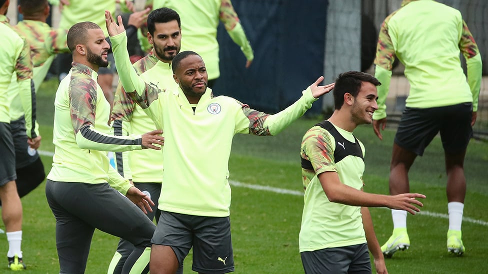 WHAT'S THE DEAL? Raheem seems to be asking a team-mate something
