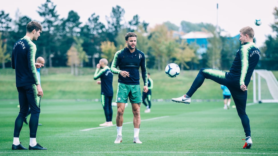 BACK TO BUSINESS : Stones, Walker and De Bruyne.