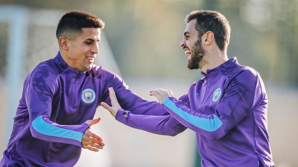 PORTUGUESE PALS : Joao Cancelo and Bernardo Silva share a joke