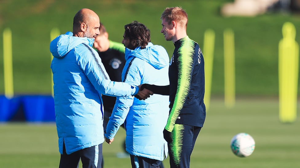 SHAKE ON IT : Manager Pep Guardiola greets Kevin De Bruyne