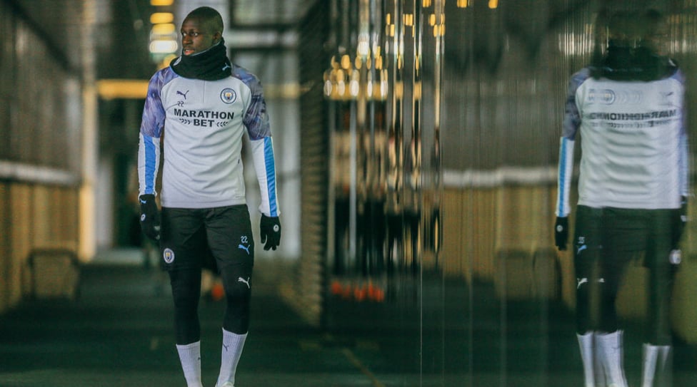 WALKING TALL : Benjamin Mendy makes his way to the training pitch.