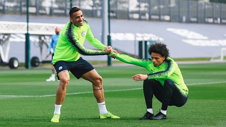 HELPING HAND: Danilo gets Leroy Sane back up onto his feet