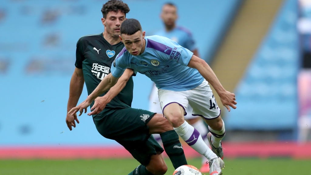 FO-RUN: The lively Foden looks to escape the clutches of Schar.