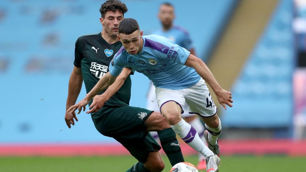 FO-RUN : The lively Foden looks to escape the clutches of Schar.