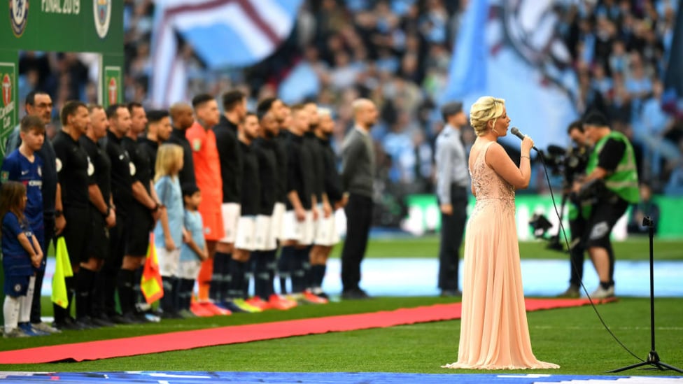 STIRRING STUFF : The national anthem is belted out prior to kick-off