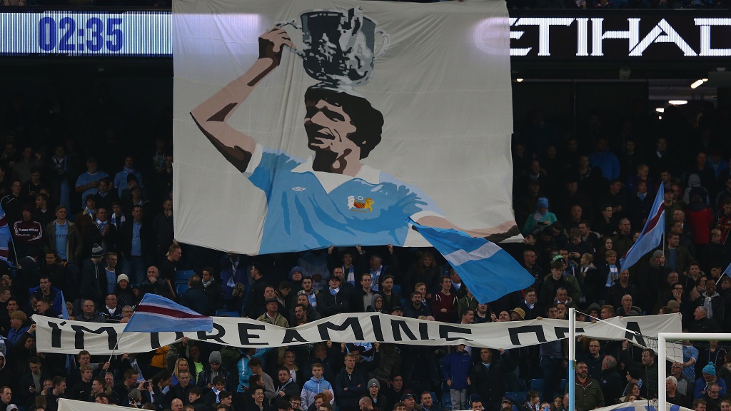 REMEMBERED : Mike Doyle flag at the Etihad