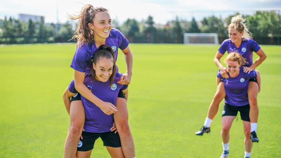 SUNSHINE ON MY SHOULDERS : The team lift one another into the new season