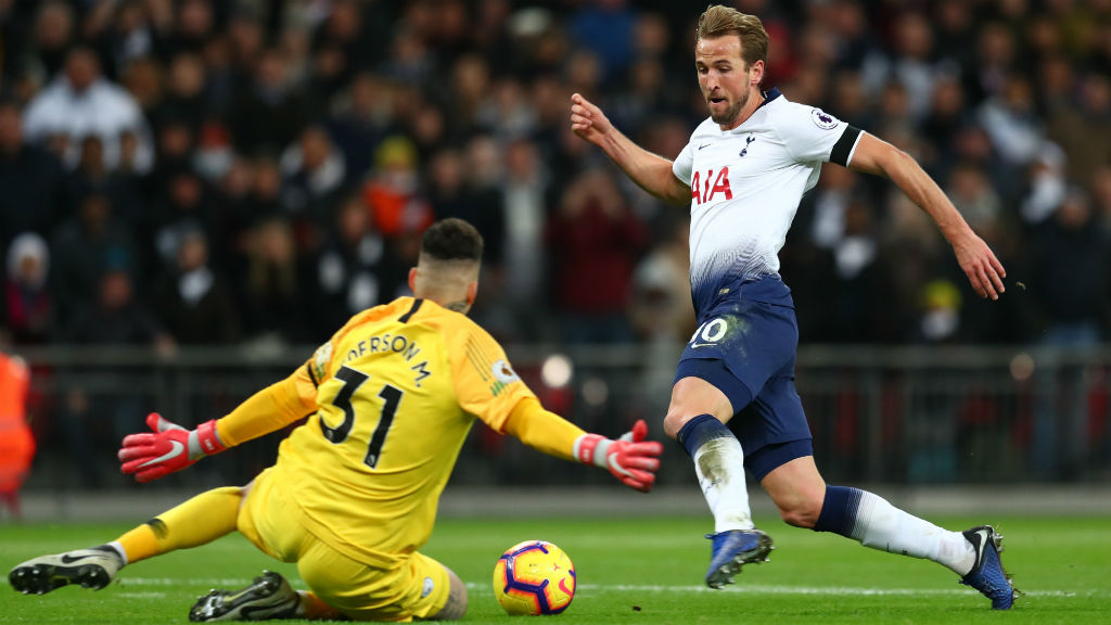 COOL HEAD : Ederson stops Harry Kane in his tracks as he charges towards goal