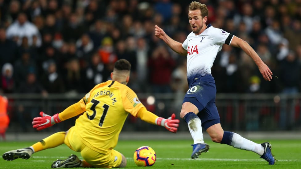 BLOCK : Ederson stops Harry Kane in his tracks as he charges towards goal.