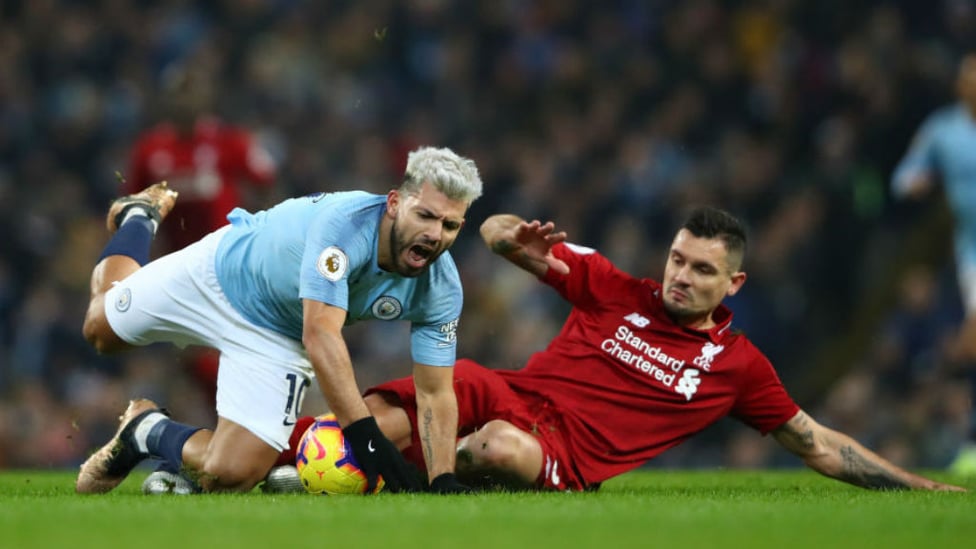 STOP START : Sergio Aguero is brought down by Dejan Lovren